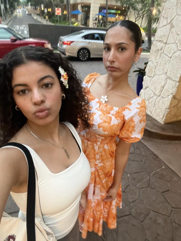 Two girls posing for a selfie.
