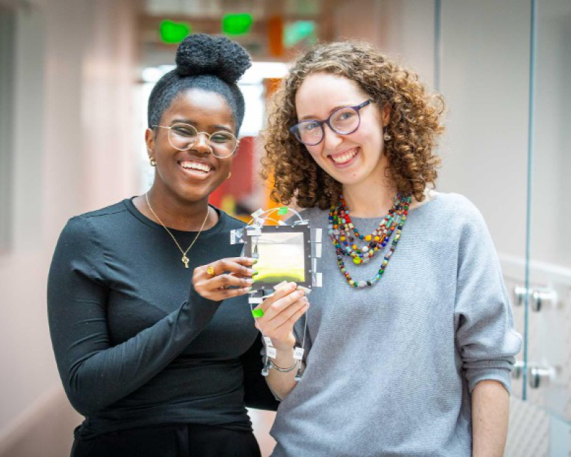 Image of Aeden and Madison posing together with their research