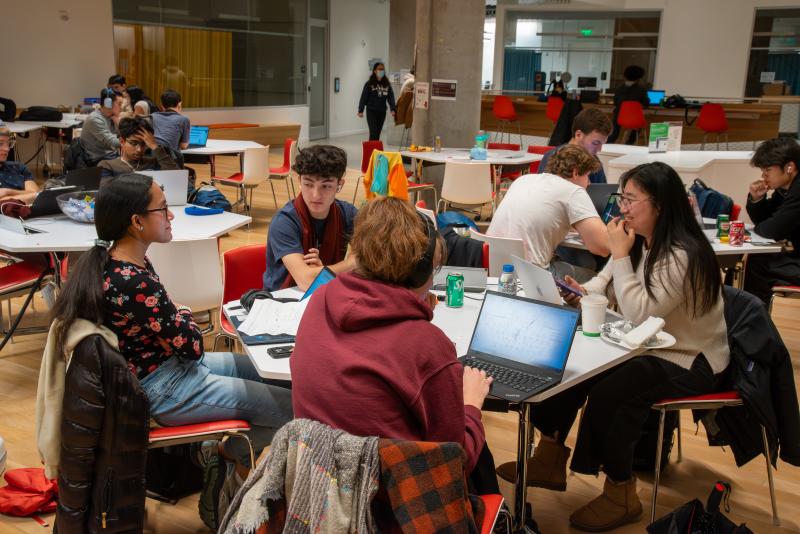 CS50 Hackathon attendees working on their final projects.