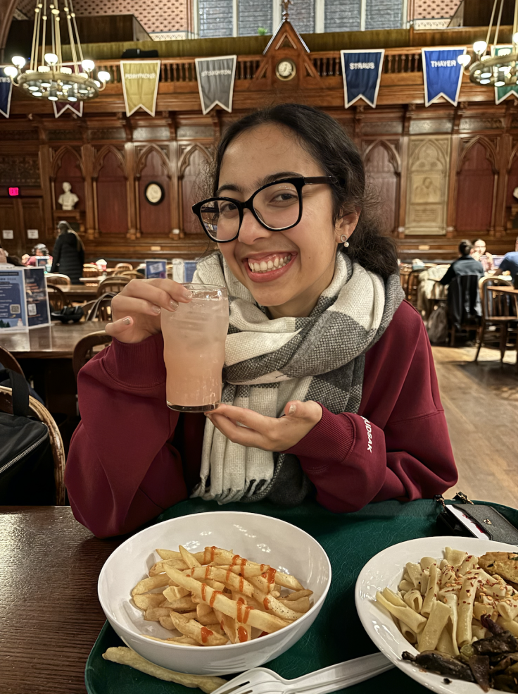 The author holding up a delicious pink drink she created, called MFizz, at Annenberg.