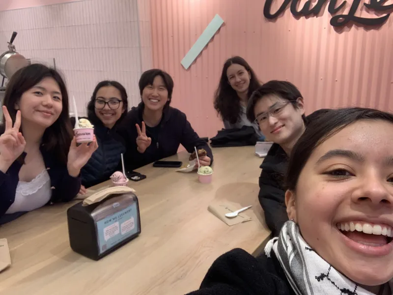 At an ice cream shop with my Sib Fam during the spring semester of my freshman year, smiling and enjoying a casual outing together.