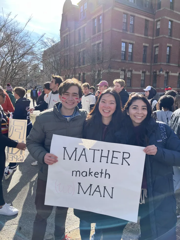 Me and my block mates posing with a sign from our house, saying "Mather Maketh Man". 