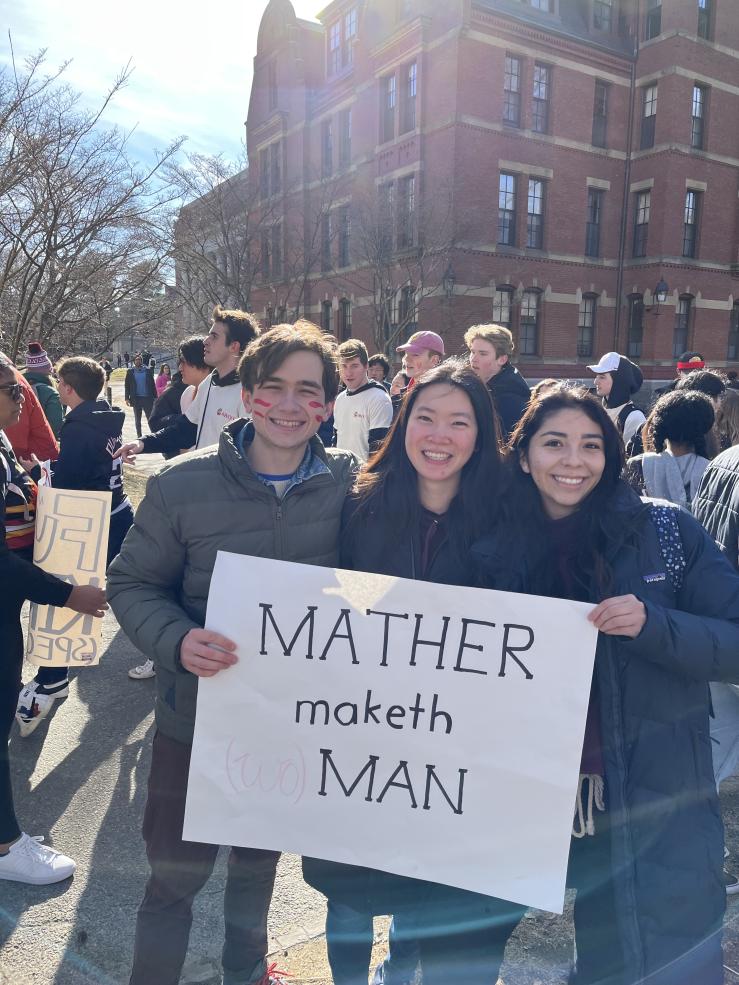 Me and my block mates posing with a sign from our house, saying "Mather Maketh Man". 