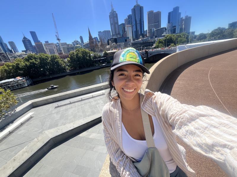 A smiling selfie on a sunny day with the Melbourne city skyline in the back