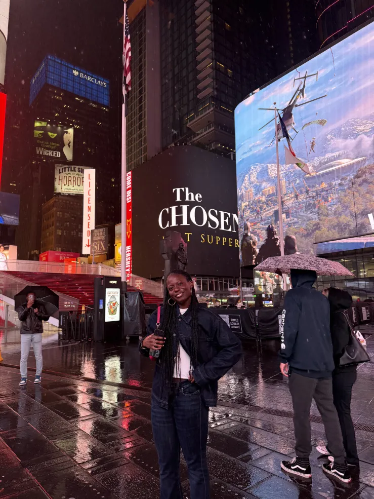 I smile for a photo at Times Square in New York City.
