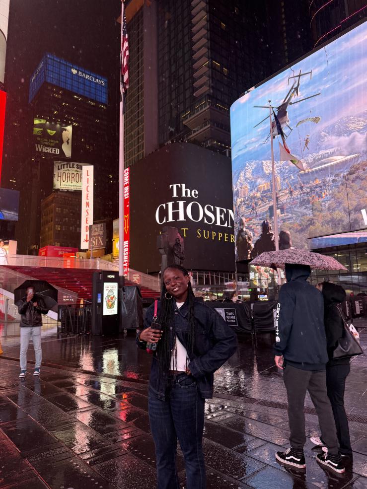 I smile for a photo at Times Square in New York City.