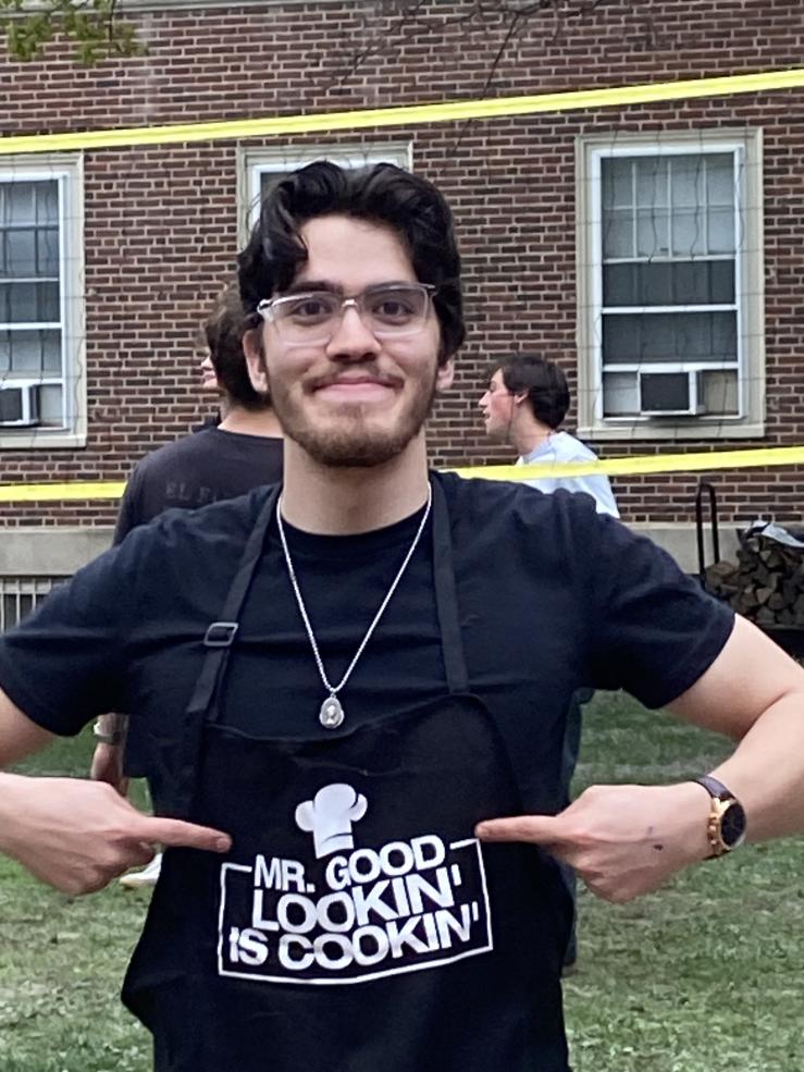 Jordy with his cooking apron that says "Mr Good Lookin' is Cookin'"