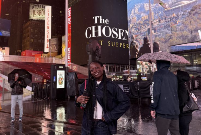 I smile for a photo at Times Square in New York City.