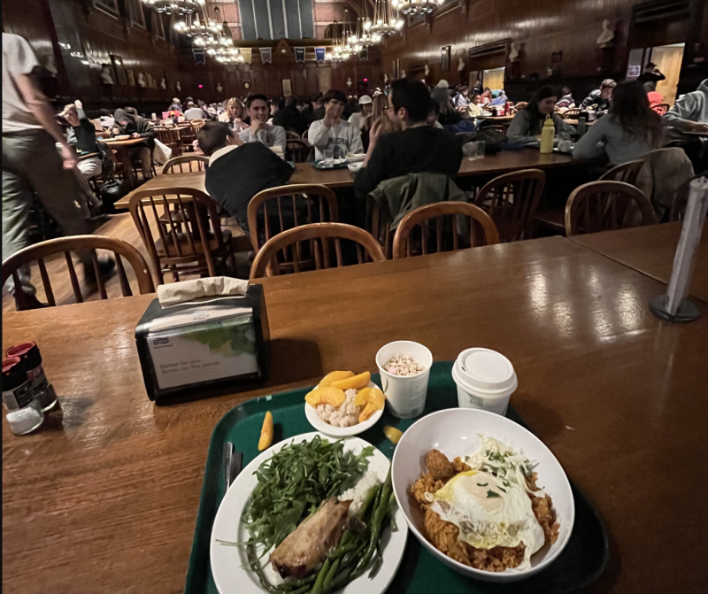 A view of Annenberg hall with a table with food in a tray.