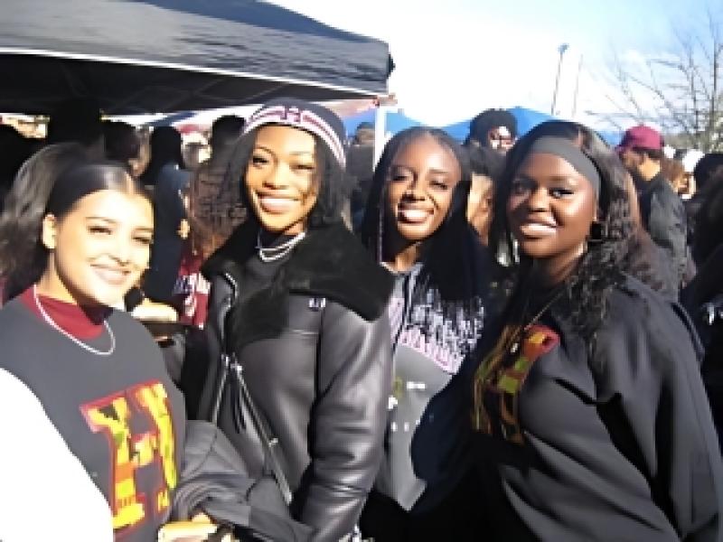 Students at the 2023 Harvard-Yale Game, Kuumba President on the left