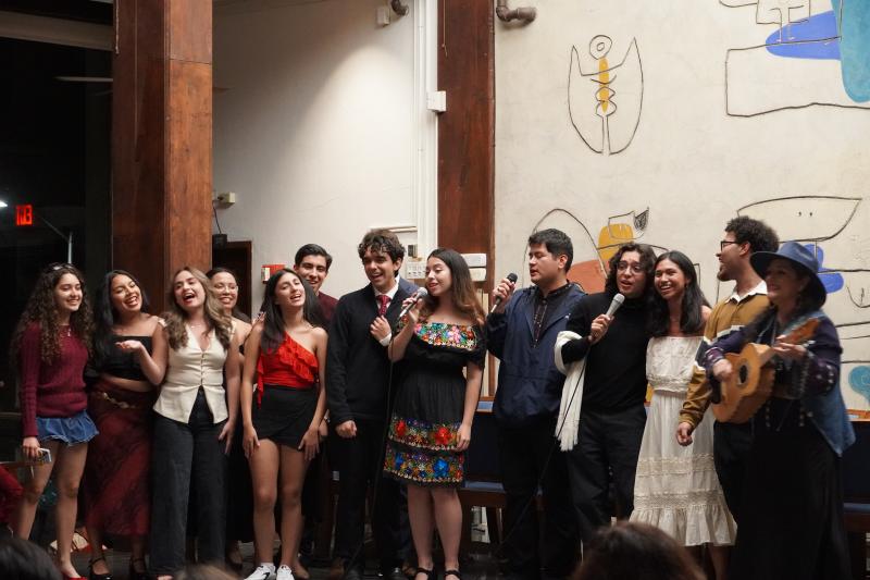Fuerza Latina board members and singers singing on stage with Veronica Robles.