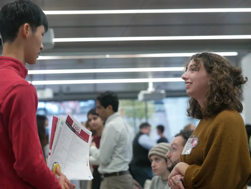Two people having a conversation at a Mignone Center of Career Success Event.