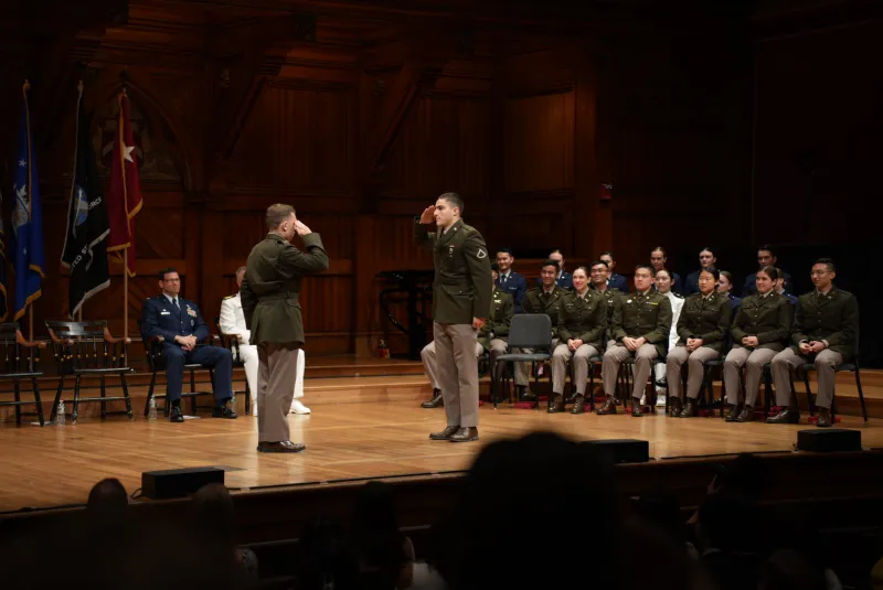 Fadule conducting a "first salute" in Sanders' Theatre for a friend's commissioning ceremony in May 2025.