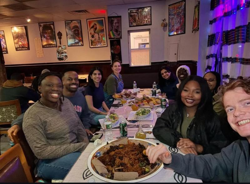 Rahma at an Ethiopian restaurant with fellow Kirkland residents