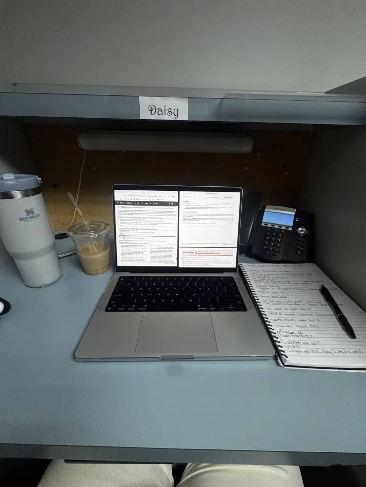 A laptop at a desk.