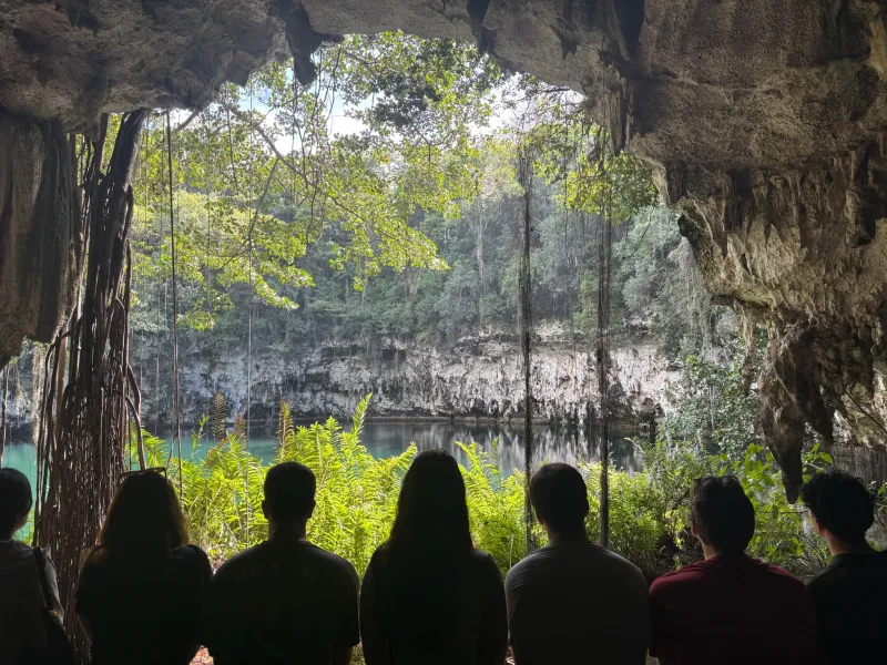 Eliana and her acapella group members posing in front of the fourth hidden lake