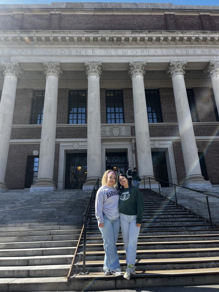Lizbeth and her sister posing in front of Widener Library steps.