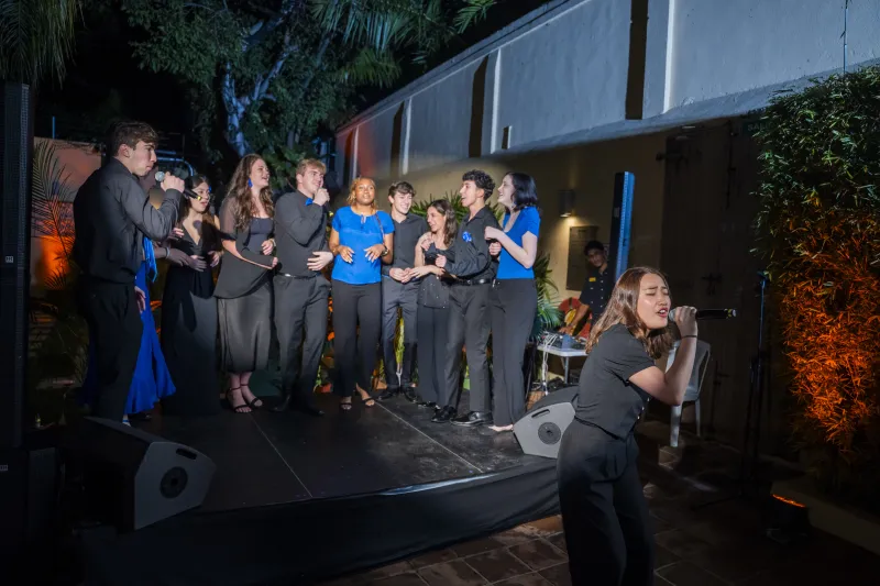 The Harvard Callbacks singing together at an event