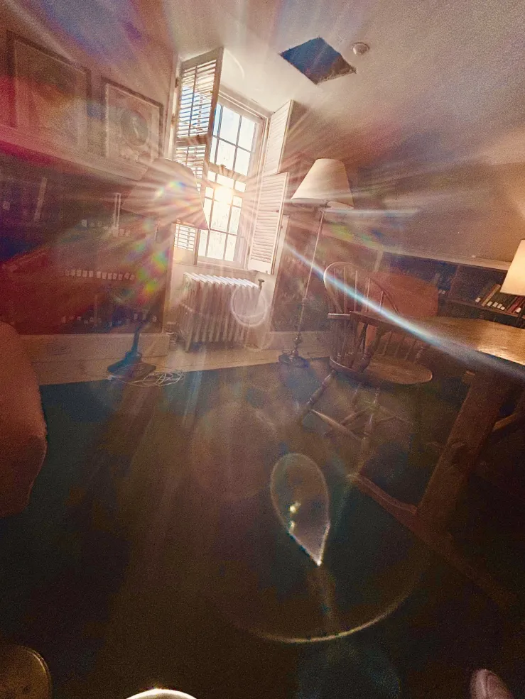 Picture of one of the rooms in Hicks House with the sun shining through the window