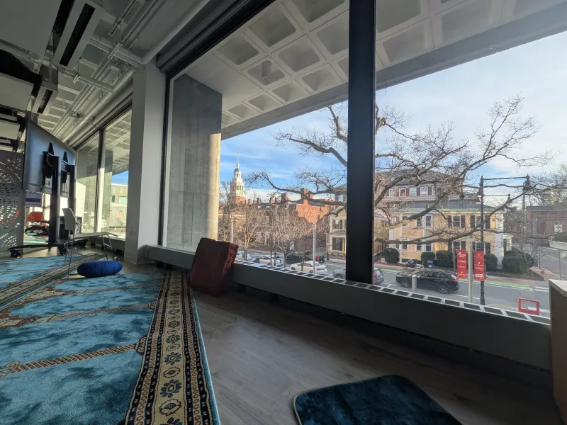 Picture of the Smith Campus prayer space with blue prayer mats and cushions.