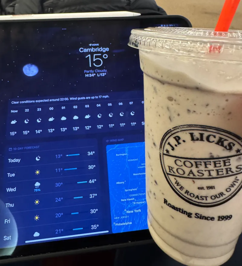 A milkshake / coffee from JP licks next to a screen showing the cold temperature