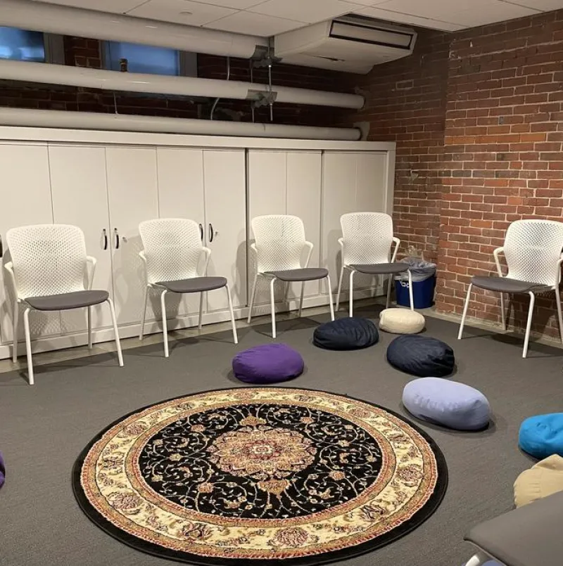 The serenity room in the Harvard Foundation. Shows a carpet with mini bean bag chairs.