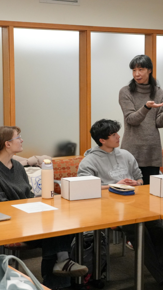 Professor Ishii talking to students. 