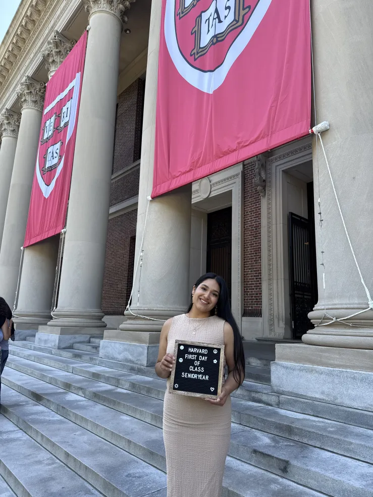 Lizbeth standing on Widener Library steps on her first day of senior year.