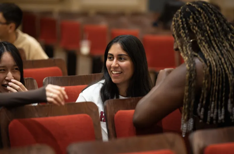 Students laughing in a theatre