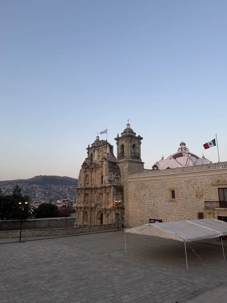 Basilica of Nuestra Señora de Soledad against a morning sunrise. 