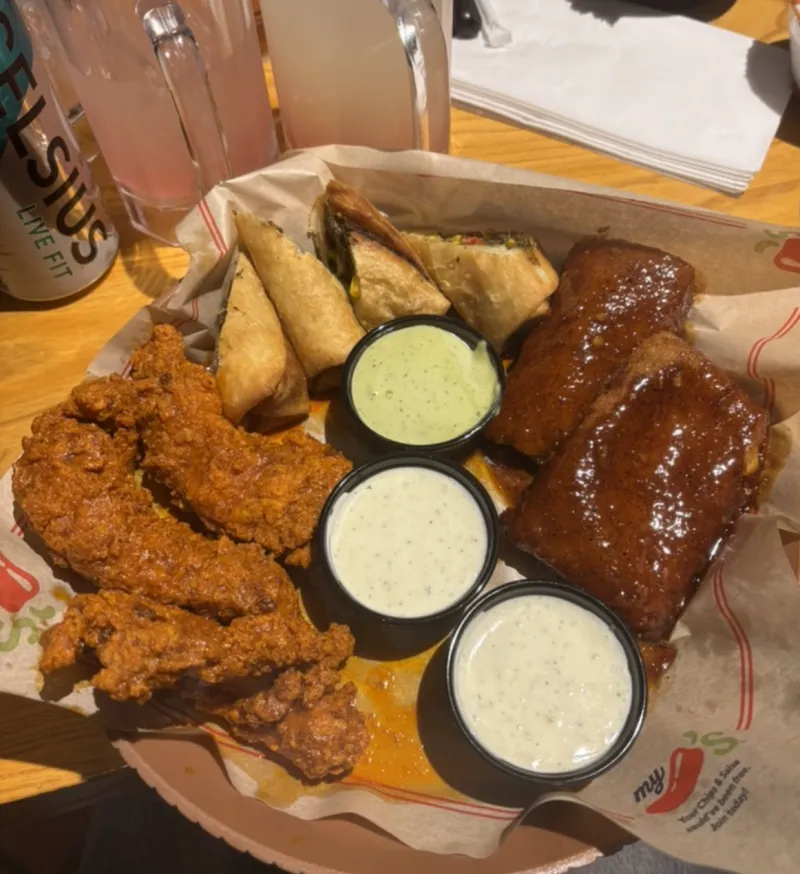 Chili's triple dipper with chicken tenders, mozzarella sticks, and southwest chicken rolls