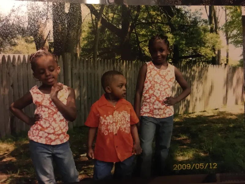 My siblings and I in matching Hawaiian Print outfits