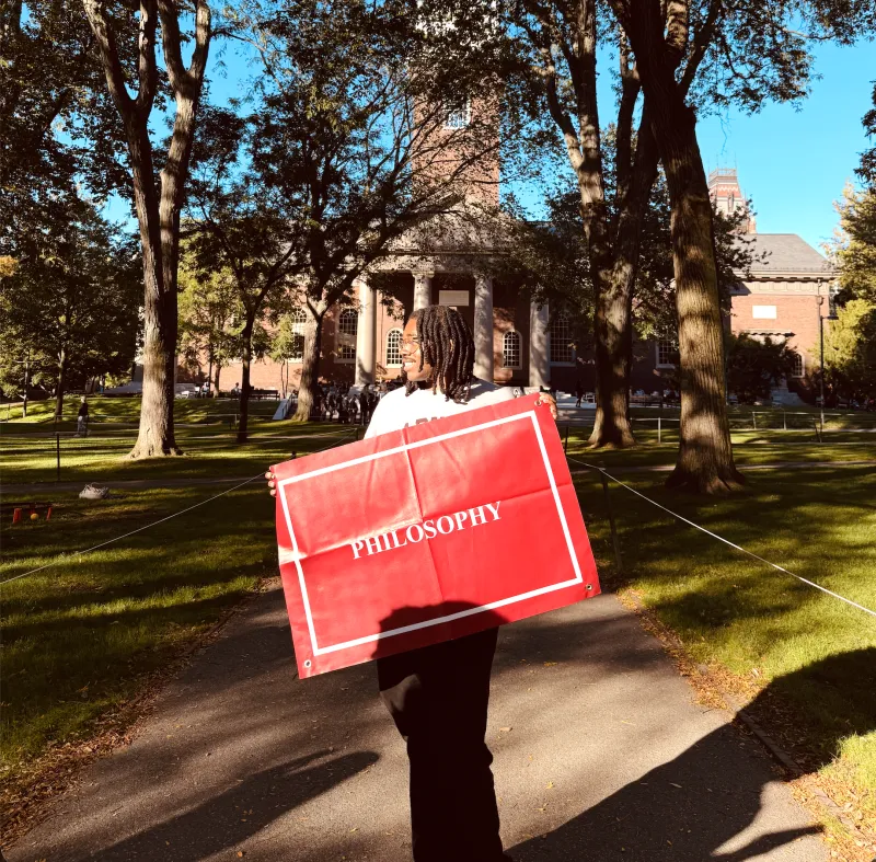 Me standing with my Philosophy banner on Concentration Declaration Day 