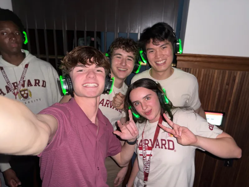 Group photo of Harvard students listening to music at a silent disco
