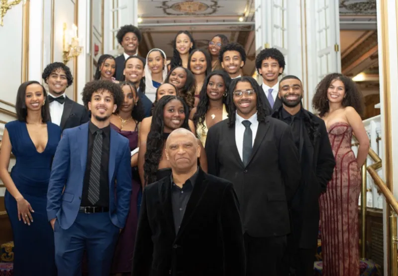 a picture of a bunch of people in formal outfits