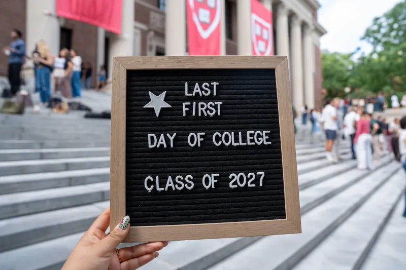 A letter board stating "Last First Day of College Class of 2027." 