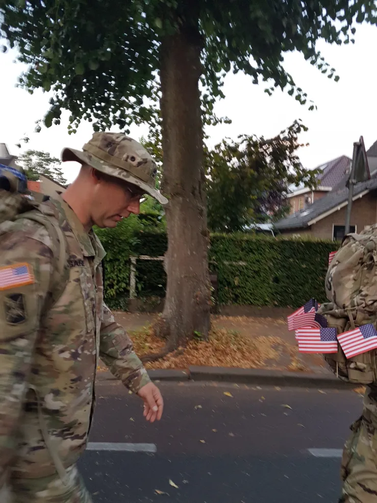 Cory Garbe '30 in his Army uniform, looking down at the ground, in 2018.