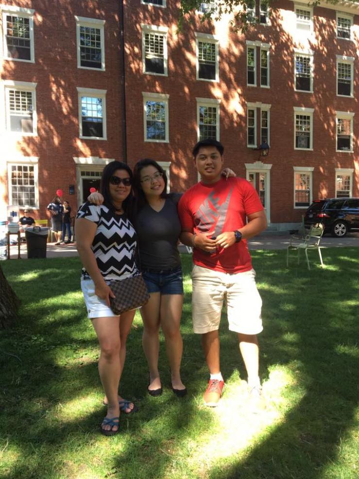 Family in front of Stoughton dormitory