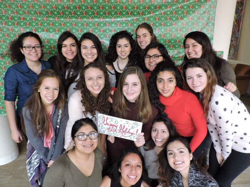 The Latinas Unidas board members posing for a picture at the Holiday party. 