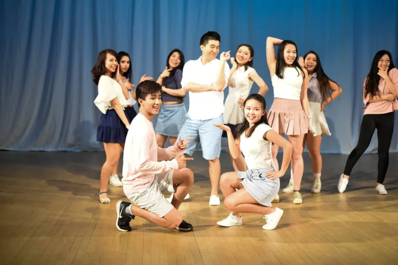 Photograph of Asian American Dance Troupe posing on stage