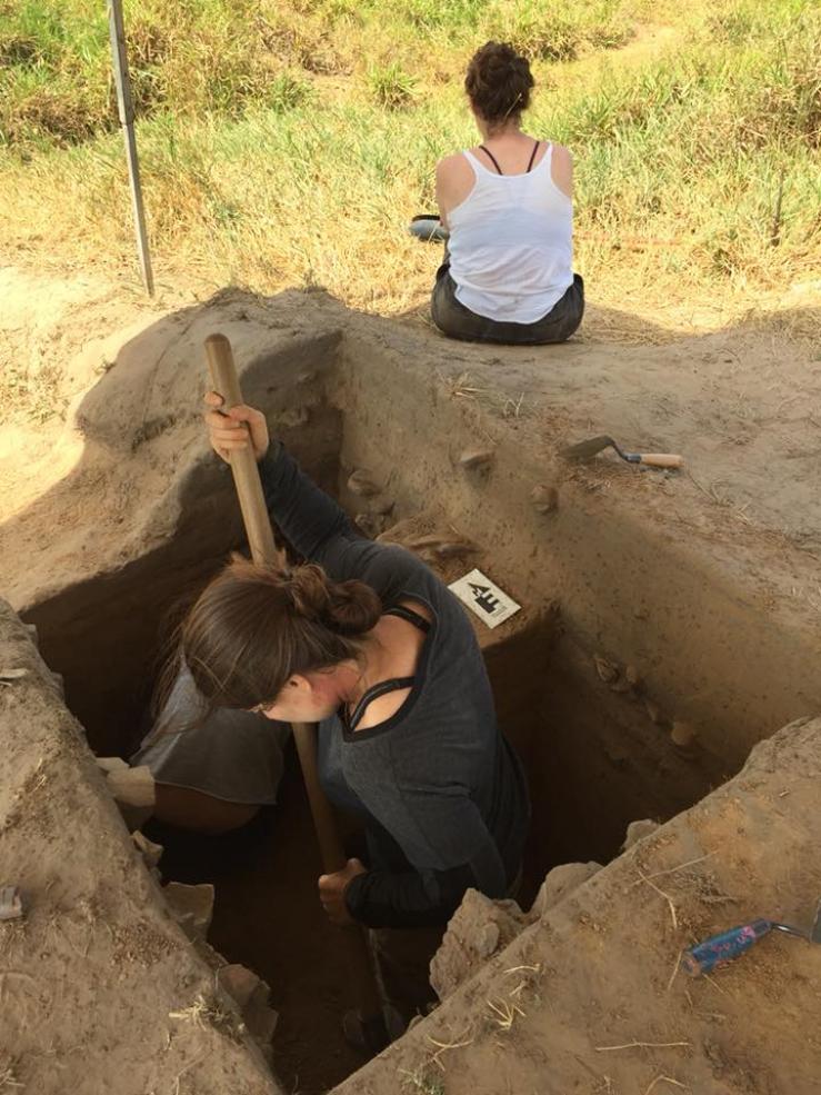 student excavating for archeological dig