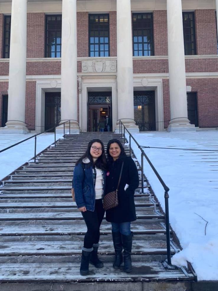 two people in front of Widener Library