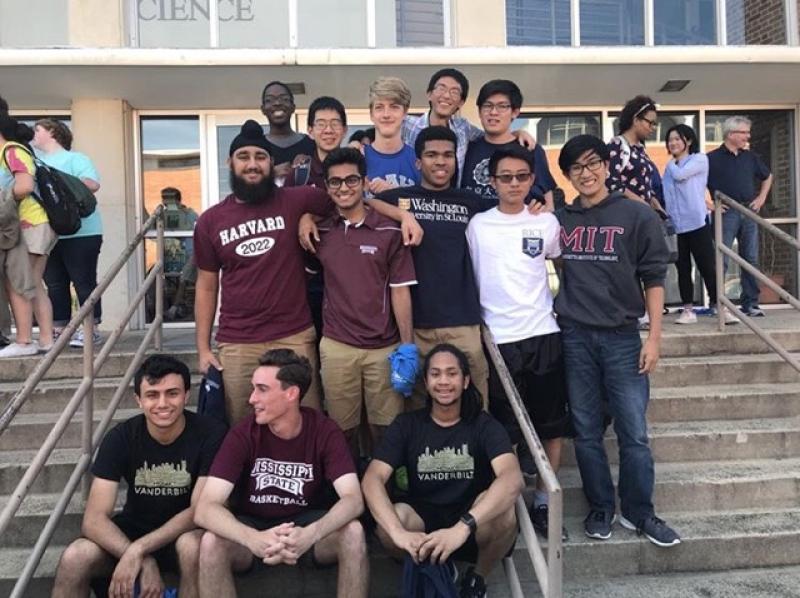 Harpreet and his high school friends posing on College Reveal Day!