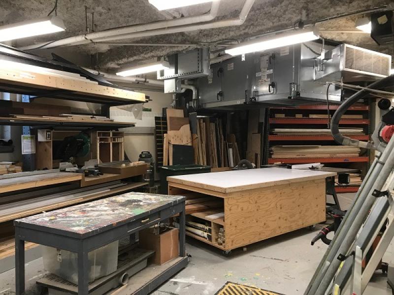 The scene shop, with tables and saws and wood set up for set building
