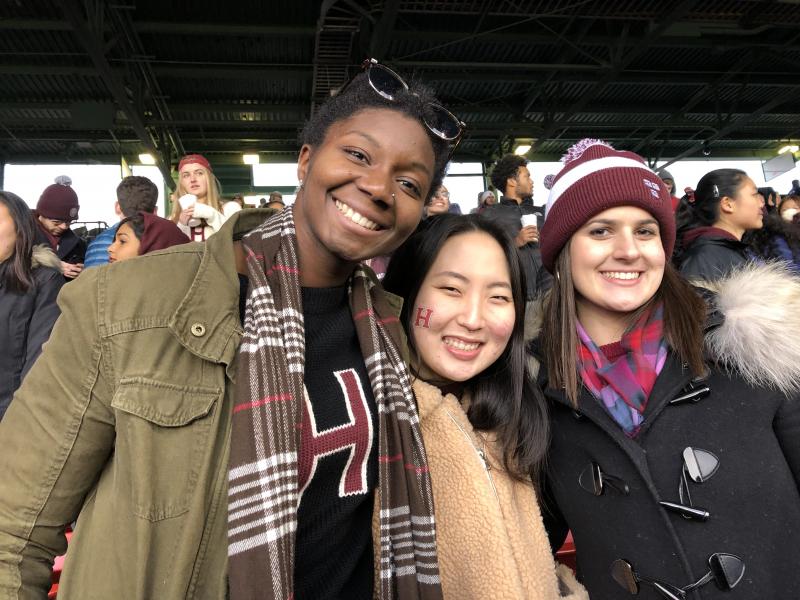 three students at the 2018 Harvard Yale game