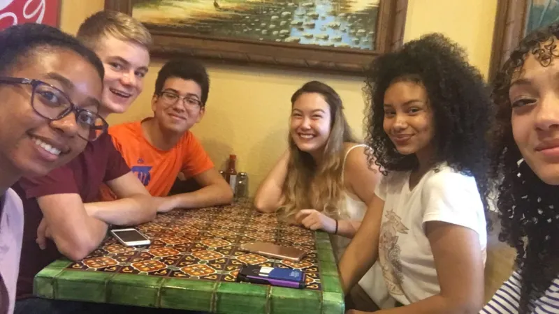 Author with friends at dining table