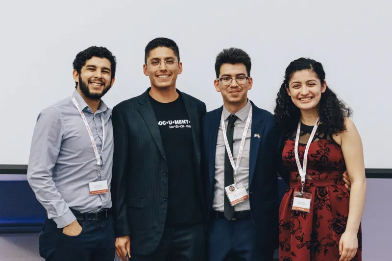 Photograph of author with peers and Justino Mora