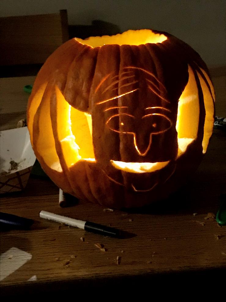 Carved Halloween pumpkin with candle inside