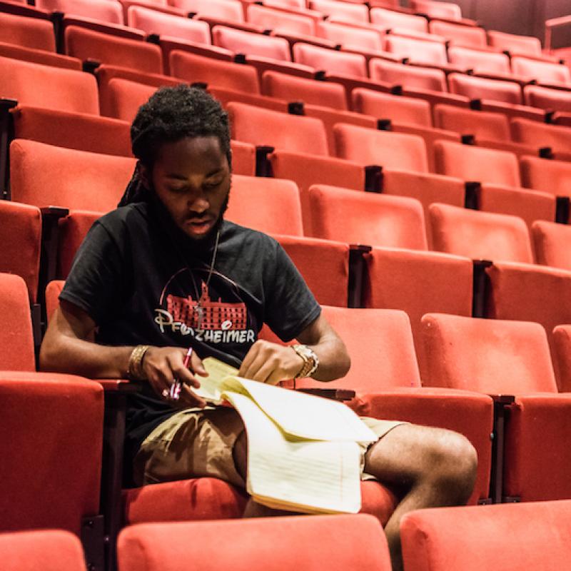 Student in theater seats