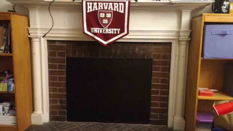 Photograph of boarded fireplace in author&#039;s dorm room